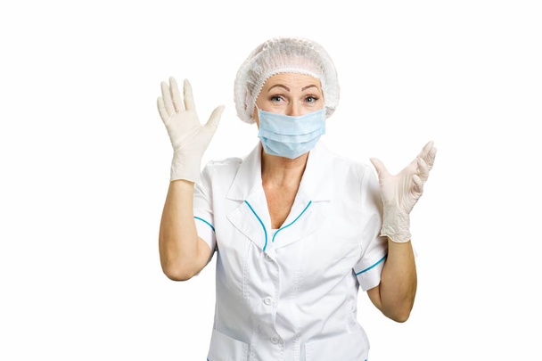 Surprised female surgeon, white background. - Fotografie, Obrázek