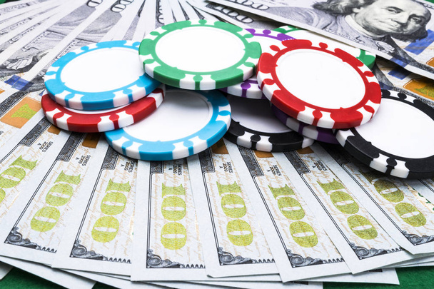 Stack of Poker chips on a dollar bills, Money. Poker table at the casino. Poker game concept. Playing a game with dice. Casino Concept. Concept for business risk. chance good luck - Valokuva, kuva