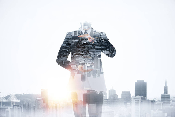 Abstract image of businessman holding copy space on creative city background. Creativity concept. Double exposure - Φωτογραφία, εικόνα