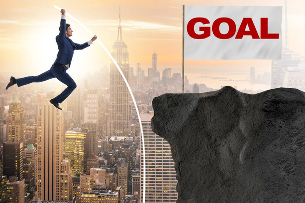 Бизнесмен прыгает с шестом к своей цели успеха - Фото, изображение
