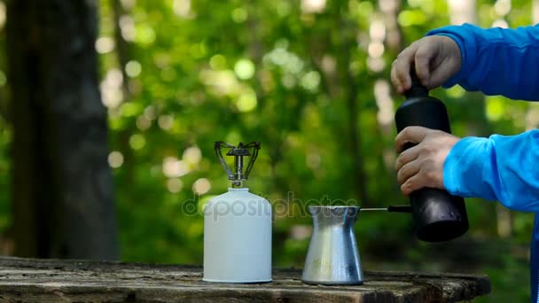 Brewing coffee in a green forest. - Footage, Video