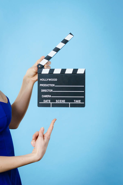 Woman holding professional film slate - Фото, изображение