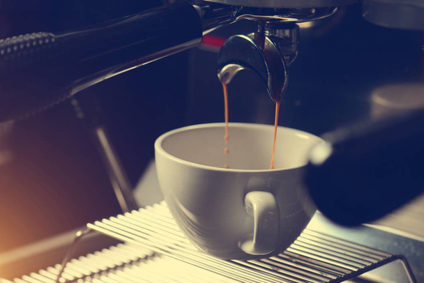 making cappuccino in coffee machine - Fotó, kép