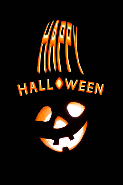 Happy Halloween pumpkin with scary face on black backgound - Zdjęcie, obraz