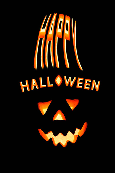 Happy Halloween pumpkin with scary face on black backgound - Fotó, kép