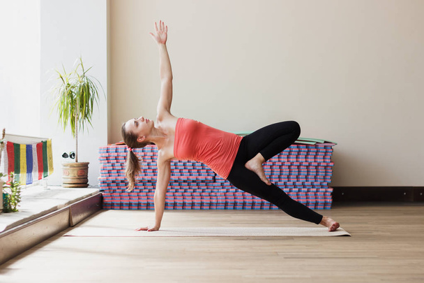 Woman makes yoga exercises - Photo, image