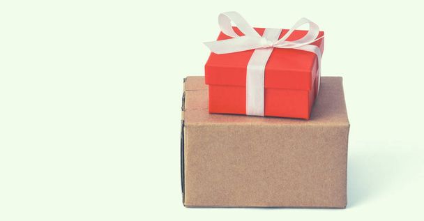 Red gift box with ribbon isolated on white background - 写真・画像