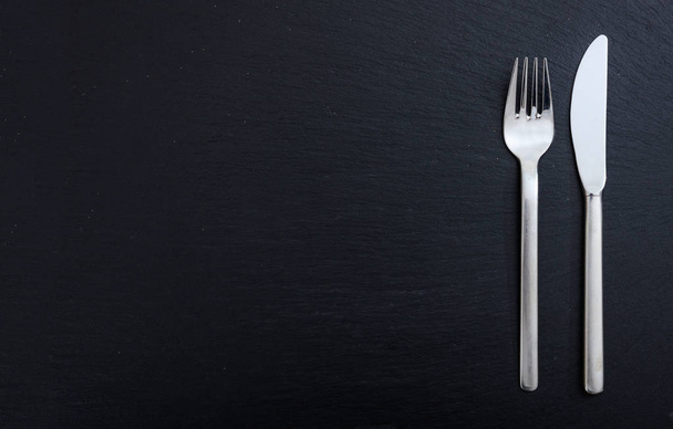 Cutlery isolated on black background - Photo, Image