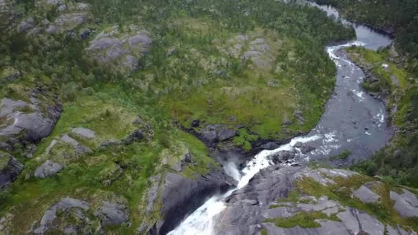Waterfall in mountains of Norway in rainy weather from air view from drone - Footage, Video