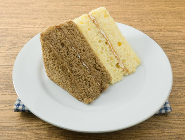Triangle Vanilla and Coffee Chiffon Cake on A Dish - Photo, Image