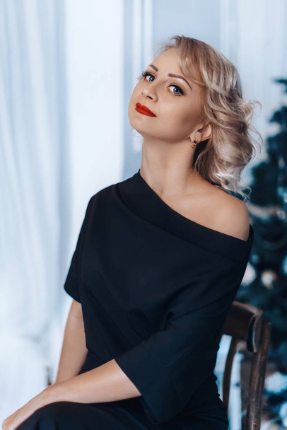 blond woman   posing in black dress - Foto, Imagen