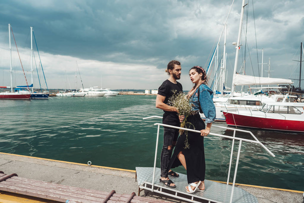 Guy and girl on pier - Photo, Image