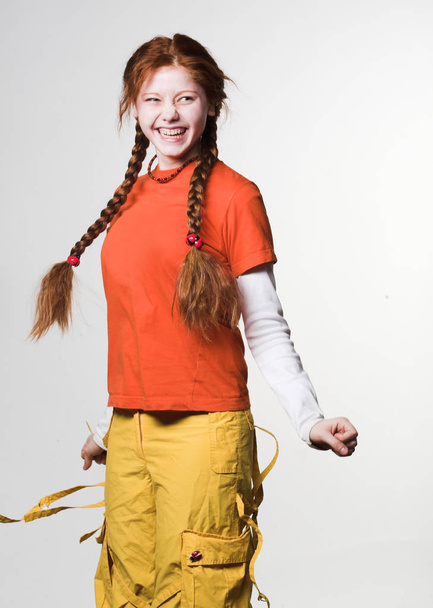 lovely redhead girl with long braids - Zdjęcie, obraz