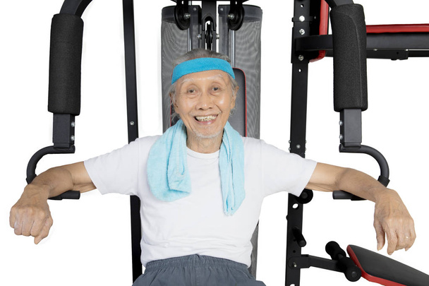Old man resting after exercise on studio - Foto, Bild