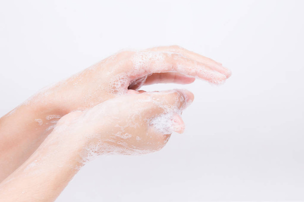 Asian girl's hands are washing with soap bubbles - Photo, image