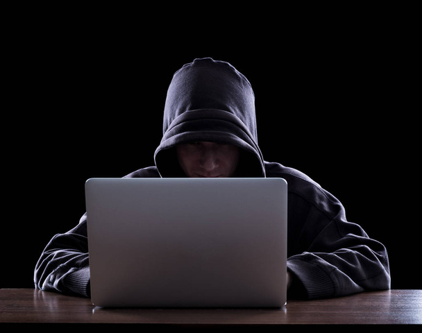 Anonymous hacker in the dark - Valokuva, kuva
