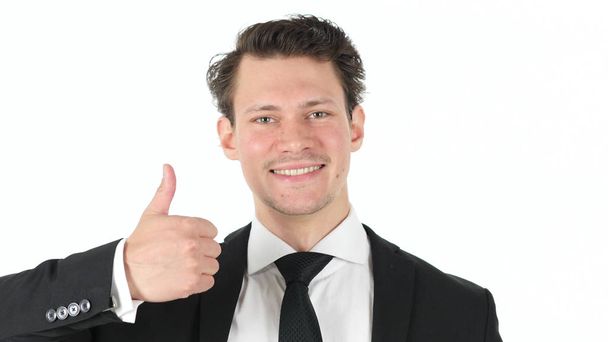Thumbs Up by Young Businessman on White Background - Photo, image