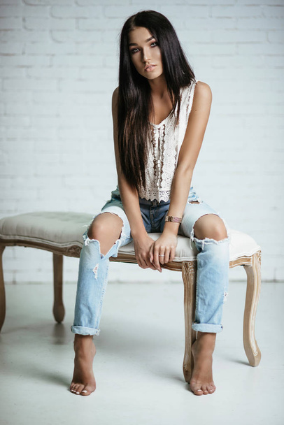 Young beautiful girl in jeans - Foto, Imagen