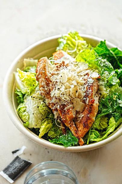 Chicken Ceasar Salad with parmesan cheese  - Photo, Image