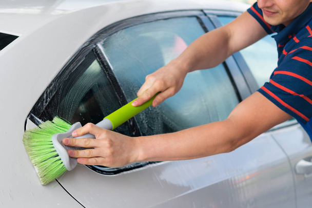 White car, wash with a green brush, with foam - Photo, Image