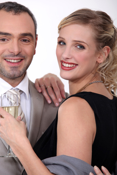 Couple in evening wear drinking champagne - Zdjęcie, obraz