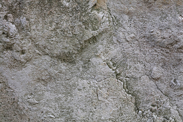 Grijze en witte ruwe stenen achtergrond close-up - Foto, afbeelding