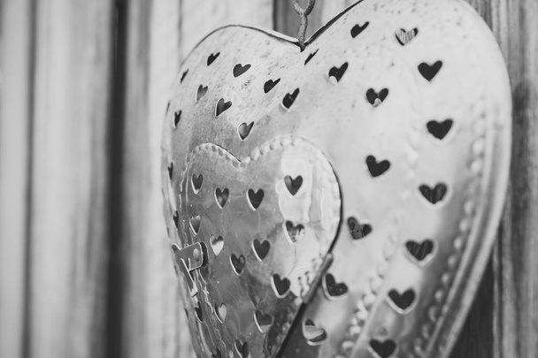 Decorative metal heart on wooden wall - Photo, Image