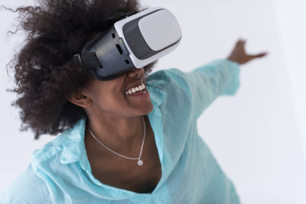 black girl using VR headset glasses of virtual reality - 写真・画像