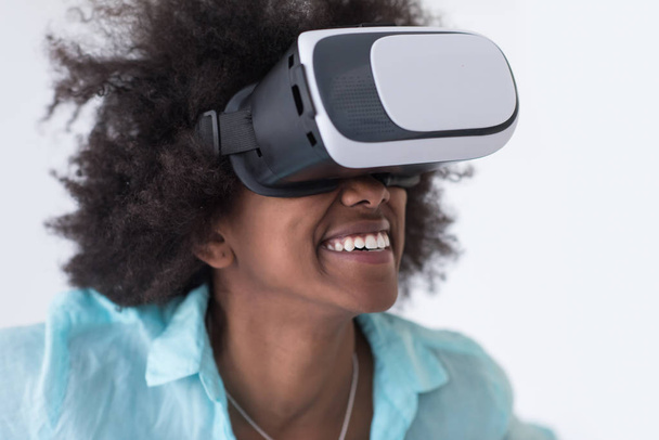 black girl using VR headset glasses of virtual reality - 写真・画像
