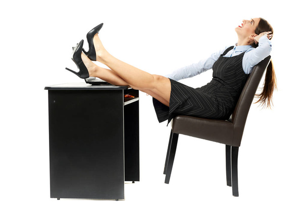 Businesswoman relaxing at desk - Foto, imagen