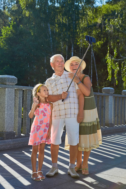 Happy grandparents and grandchild, selfie. - Photo, Image