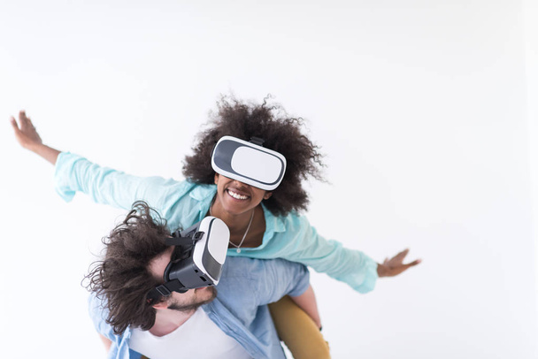 multiethnic couple getting experience using VR headset glasses  - Фото, зображення