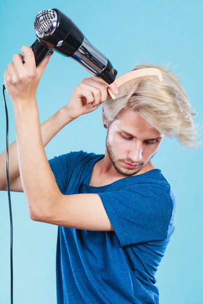 Trendy man with hair dryer - Zdjęcie, obraz