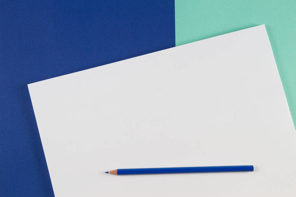 Blue colored pencils on blue color background - Photo, Image