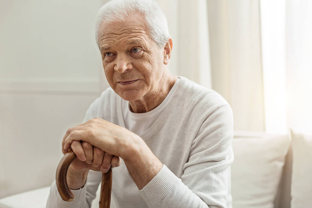 Nice retired man resting at home - Фото, изображение