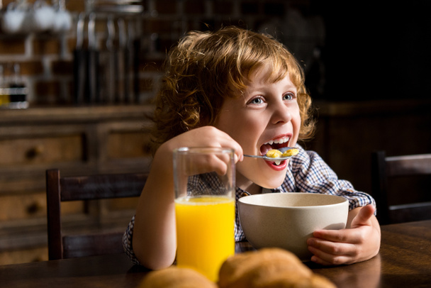child eating breakfast - Photo, Image