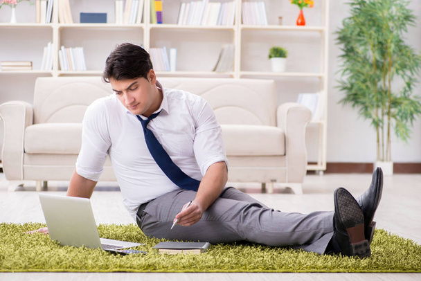 Businessman sitting on the floor in office - Foto, immagini