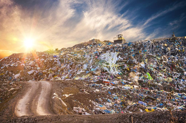 Pollution concept. Garbage pile in trash dump or landfill at sun - Photo, Image
