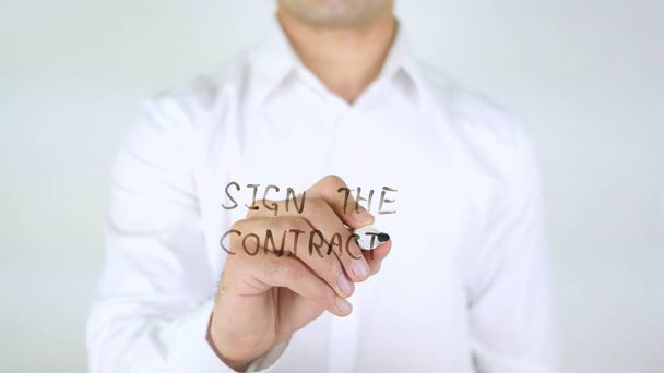 Підписати контракт, людина пише на склі
 - Фото, зображення