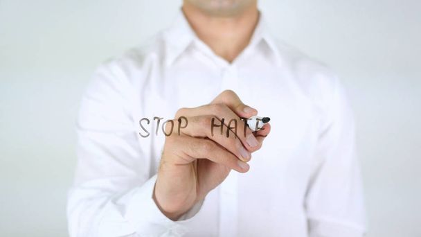 Stop Hate, Man Writing on Glass - Foto, Bild