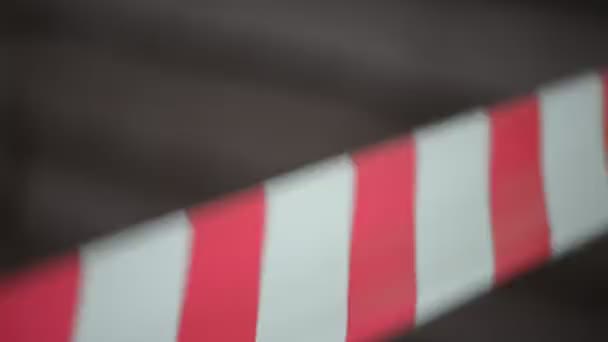Striped red-and-white tape warns of dangerous area with limited access. - Footage, Video