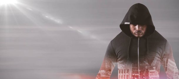 Male robber in black hoodie - 写真・画像