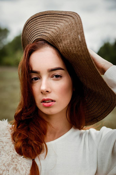 young woman in hat - Фото, изображение