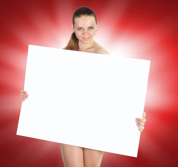 Beautiful young woman with a white empty blank pose in the studi - Foto, immagini