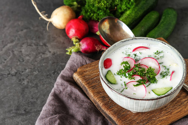 Summer cold soup - okroshka in a ceramic bowl. Ingredients of po - Photo, image