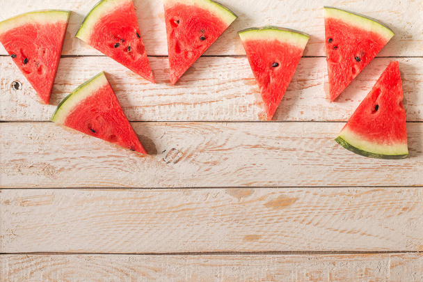 Slices of watermelon on wooden table. - Foto, immagini
