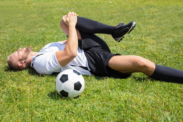 Player Suffering From Leg Injury - Valokuva, kuva