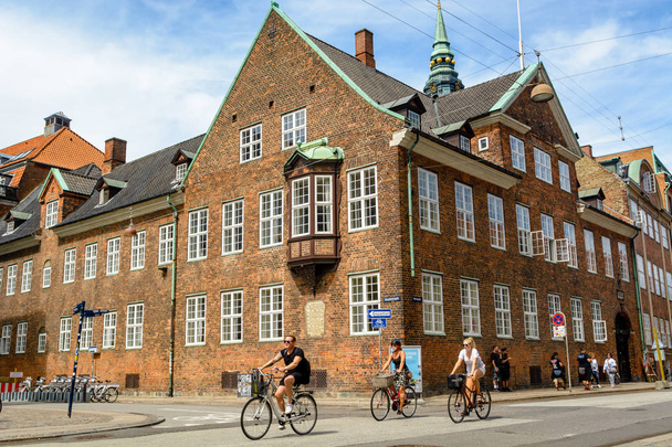 Cyclists pedal in Copenhagen, Denmark - Фото, изображение
