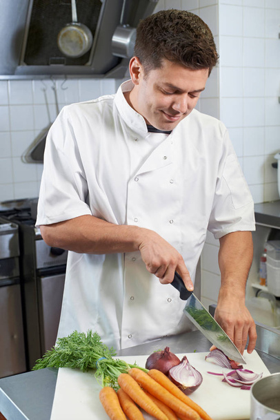 Chef Preparing Vegetables In Restaurant Kitchen - 写真・画像
