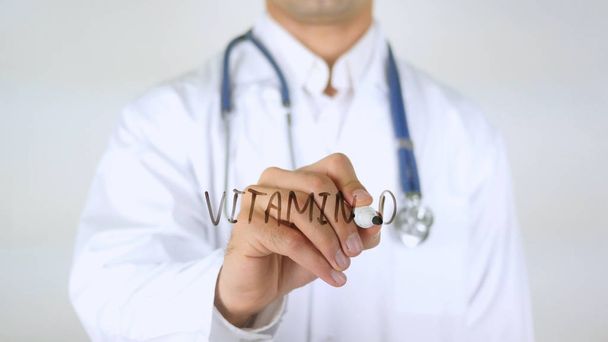 Vitamina D, Doctor escribiendo sobre vidrio
 - Foto, Imagen